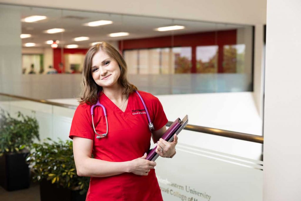 Northeastern nursing student holding clipboard