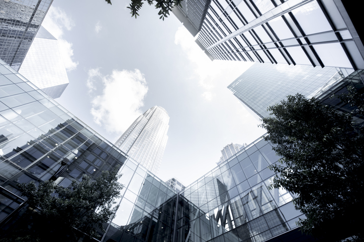 looking up at buildings and sky from street