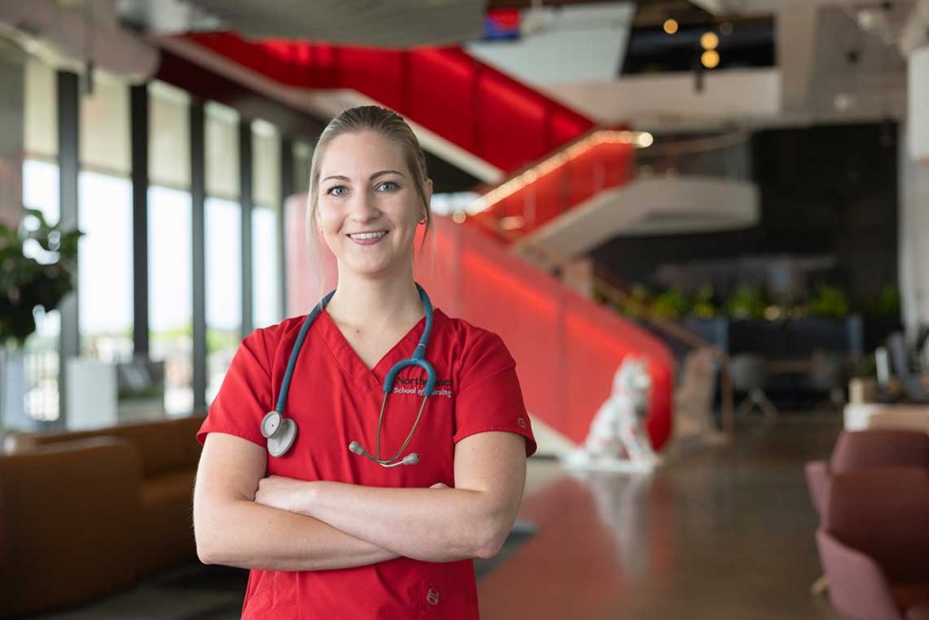 NEU nursing student smiling in lobby