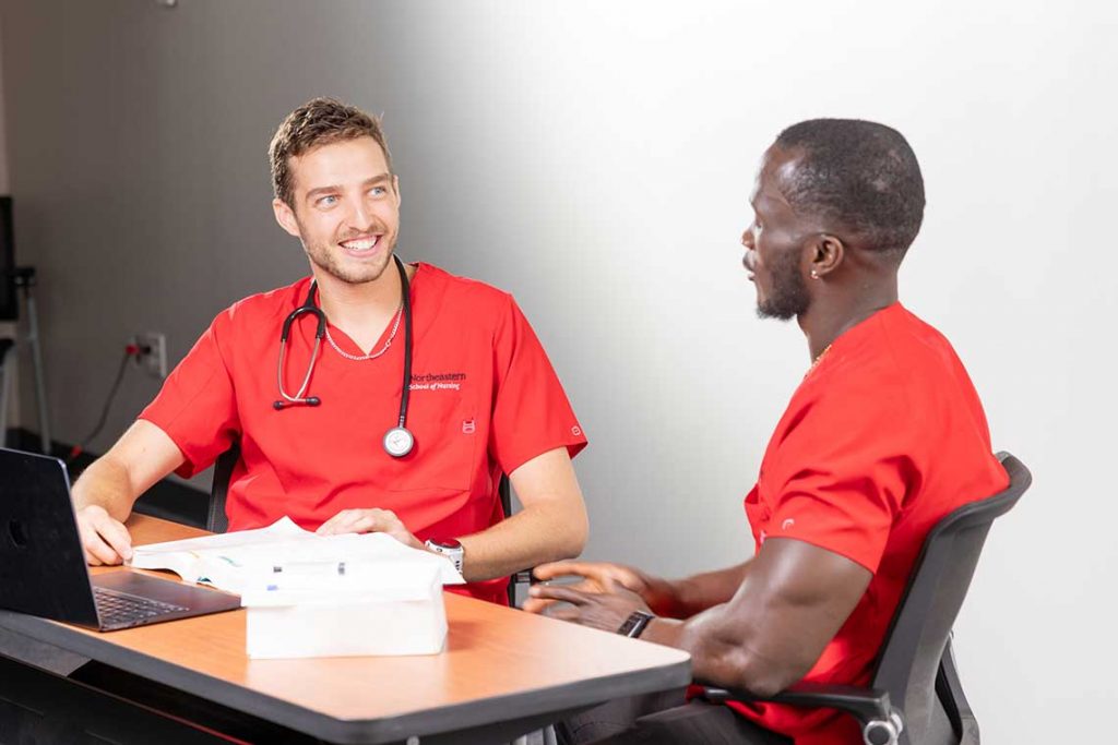 two NEU nursing students studying
