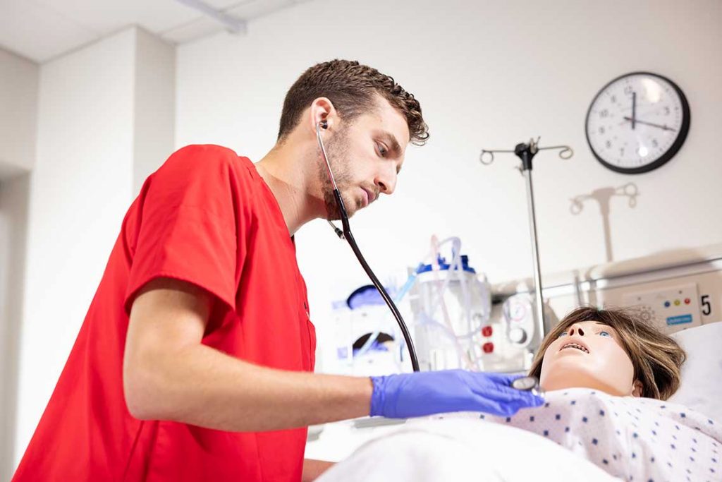 NEU nursing student in sim lab