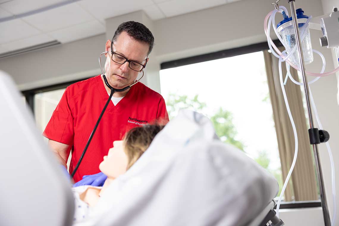 NEU nursing student in sim lab