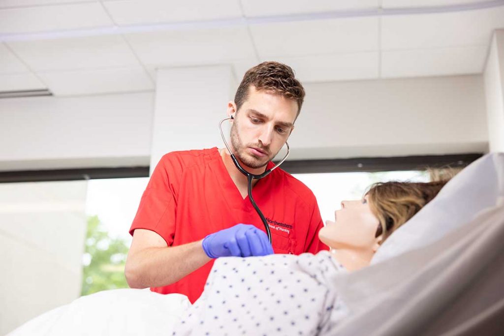 NEU nursing student in sim lab