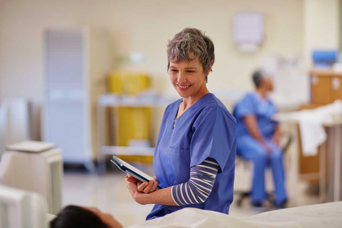 NEU absn student smiling at patient