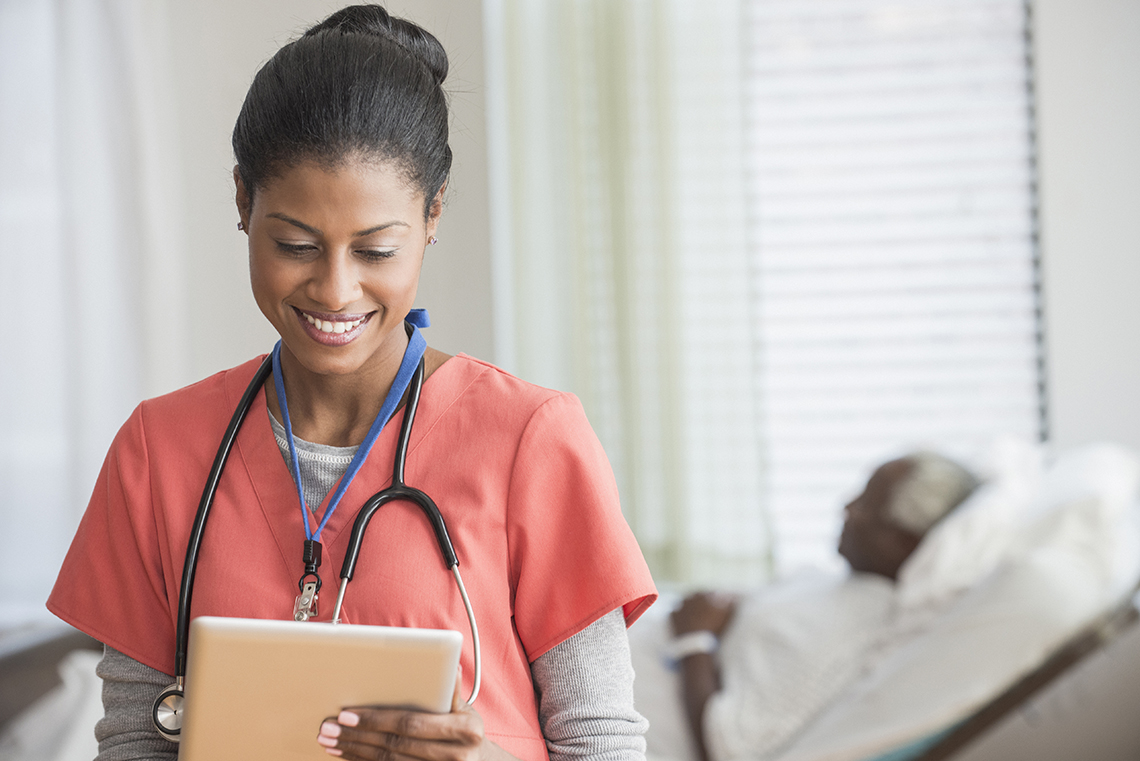 Nurse holding a tablet